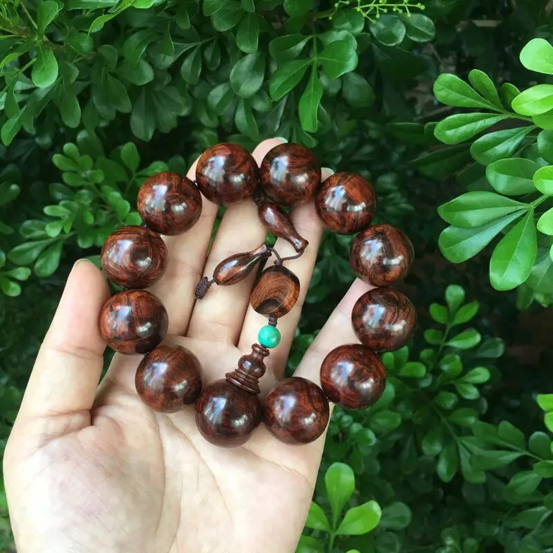 【海南黄花梨油梨 20mm手串 正心鬼脸纹 纹理殉丽 色泽柔和 荧光十足 玻璃底 收藏送礼佳品 重51.7克】图4