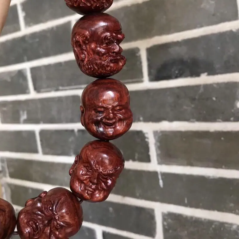 【海南黄花梨油梨 【十八罗汉➕1颗】手持 全手工精工雕琢,一流雕工,各具神态,精美造型,十分唯美,油性一流,香味扑鼻,神韵十足,值得收藏!重157克 2·9X2·4cm!】图7