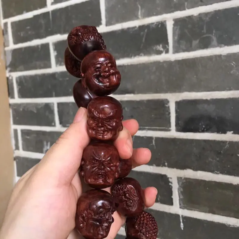【海南黄花梨油梨 【十八罗汉➕1颗】手持 全手工精工雕琢,一流雕工,各具神态,精美造型,十分唯美,油性一流,香味扑鼻,神韵十足,值得收藏!重157克 2·9X2·4cm!】图1