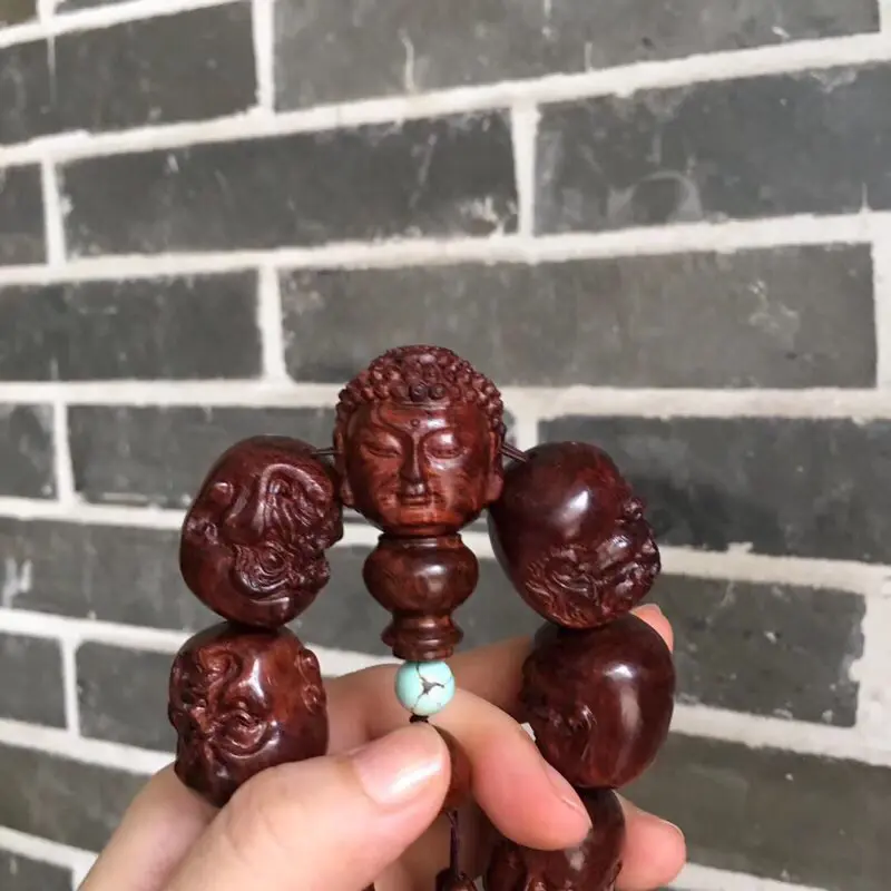 【海南黄花梨油梨 【十八罗汉➕1颗】手持 全手工精工雕琢,一流雕工,各具神态,精美造型,十分唯美,油性一流,香味扑鼻,神韵十足,值得收藏!重157克 2·9X2·4cm!】图4