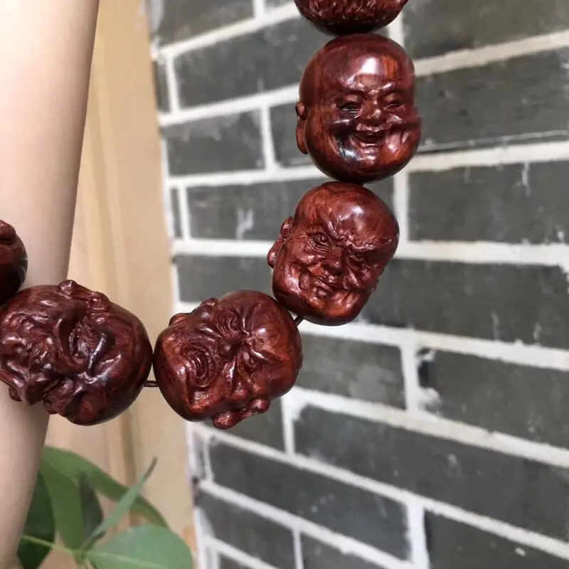 【海南黄花梨油梨 【十八罗汉➕1颗】手持 全手工精工雕琢,一流雕工,各具神态,精美造型,十分唯美,油性一流,香味扑鼻,神韵十足,值得收藏!重157克 2·9X2·4cm!】图6