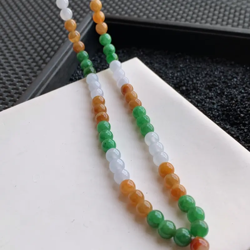 【🙏缅甸天然翡翠A货 108颗冰润三彩圆珠项链,克重65.37,尺寸:7,寓意峰回路转,圆圆满满,财富越聚越多,福气越大,质地细腻,圆润饱满,三彩颜色艳丽,颗颗精挑细选,完美度高,可当毛衣链,佩戴效果落落大方!性价比高!】图9