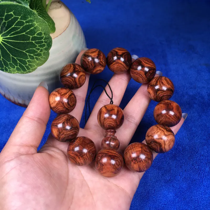 【海南黄花梨糠梨 20mm/12颗对眼X纹 颗颗圆润饱满 颜色均匀 线条流畅自然 重45.1g】图7