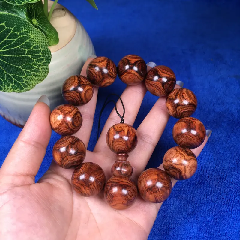 【海南黄花梨糠梨 20mm/12颗对眼X纹 颗颗圆润饱满 颜色均匀 线条流畅自然 重45.1g】图5