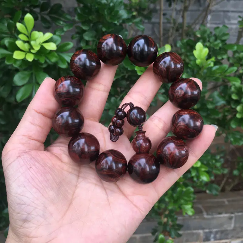 【海南黄花梨西部霸王岭紫油梨2.0规格的手串,玻璃质感,荧光感十足,鬼眼对眼京剧脸谱,克重52.2g】图4
