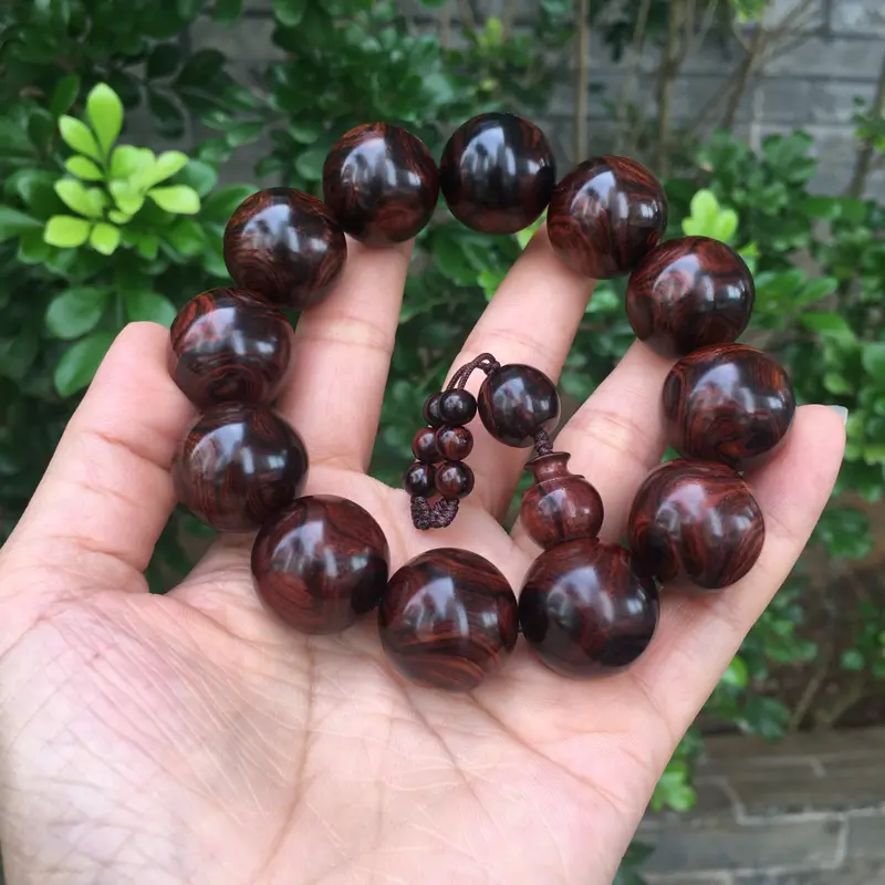【海南黄花梨西部霸王岭紫油梨2.0规格的手串,玻璃质感,荧光感十足,鬼眼对眼京剧脸谱,克重52.2g】图8