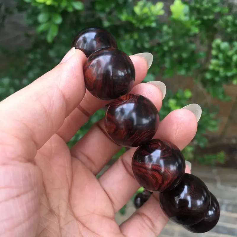 【海南黄花梨西部霸王岭紫油梨2.0规格的手串,玻璃质感,荧光感十足,鬼眼对眼京剧脸谱,克重52.2g】图9