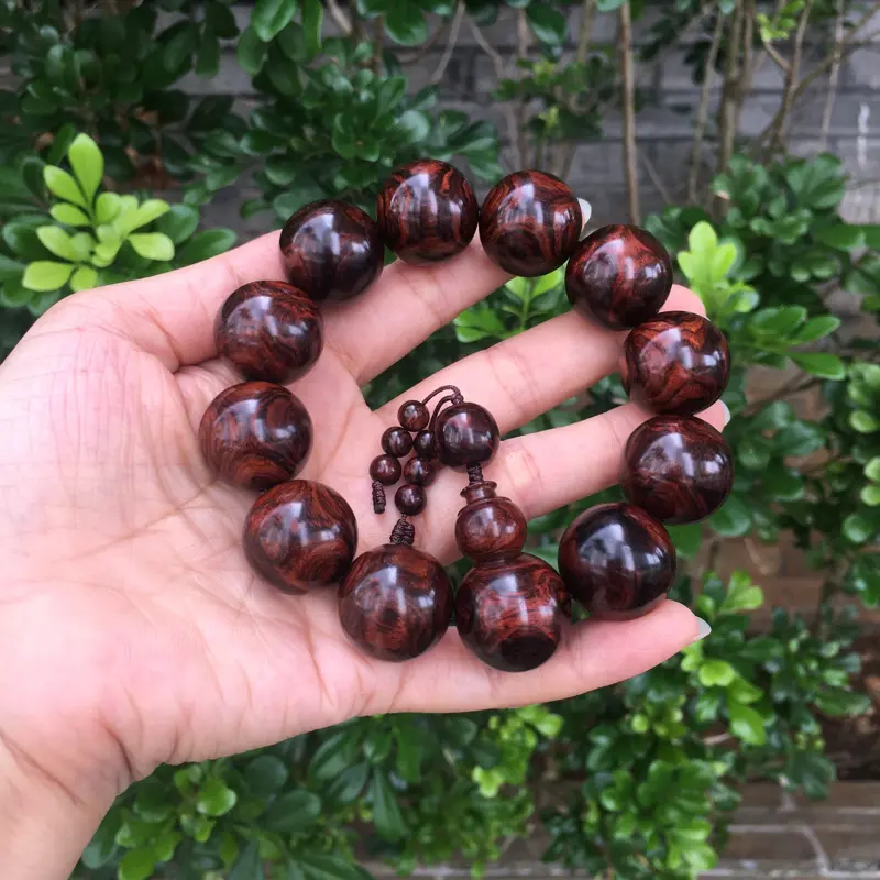 【海南黄花梨紫油全鬼眼对眼2.0规格手串,材质细腻饱满圆润,底色干净透亮,克重53g】图1