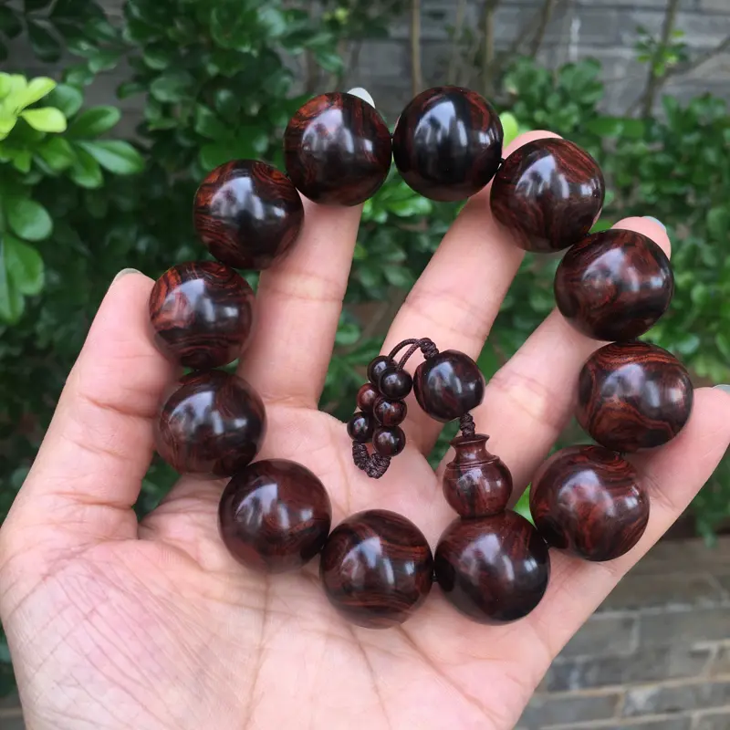 【海南黄花梨西部霸王岭紫油梨2.0规格的手串,玻璃质感,荧光感十足,鬼眼对眼京剧脸谱,克重52.2g】图11