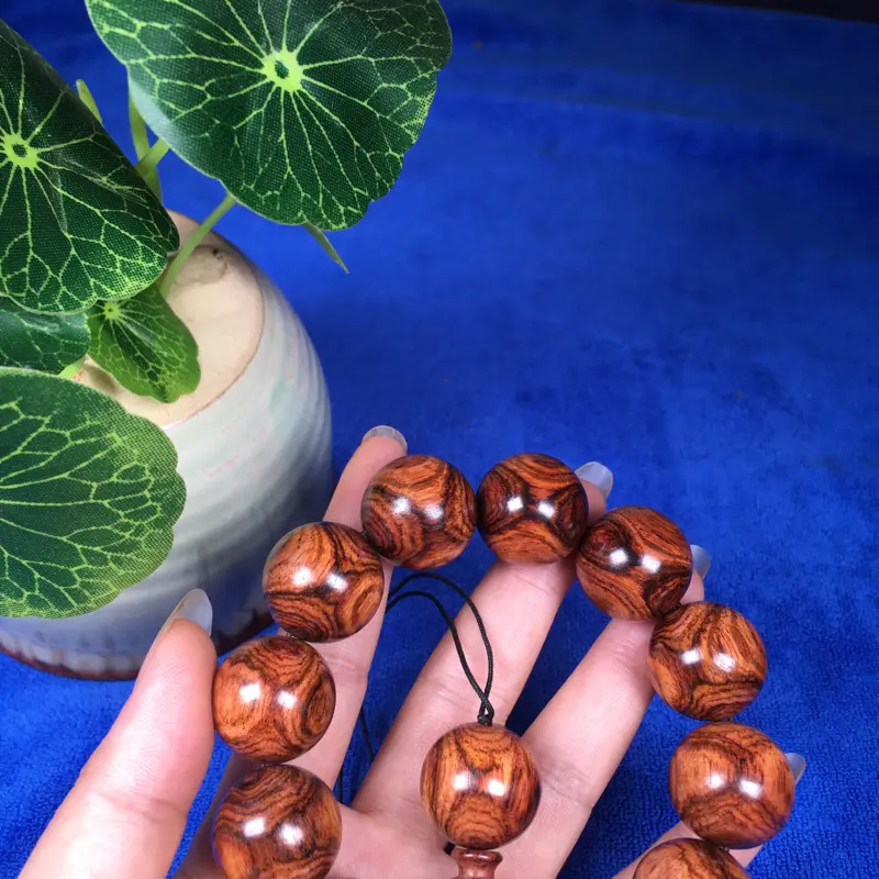 【海南黄花梨糠梨 20mm/12颗对眼X纹 颗颗圆润饱满 颜色均匀 线条流畅自然 重45.1g】图6
