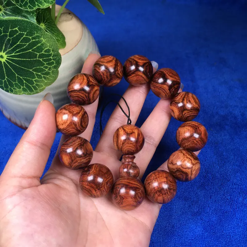 【海南黄花梨糠梨 20mm/12颗对眼X纹 颗颗圆润饱满 颜色均匀 线条流畅自然 重45.1g】图9