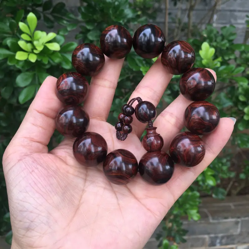 【海南黄花梨西部霸王岭紫油梨2.0规格的手串,玻璃质感,荧光感十足,鬼眼对眼京剧脸谱,克重52.2g】图2