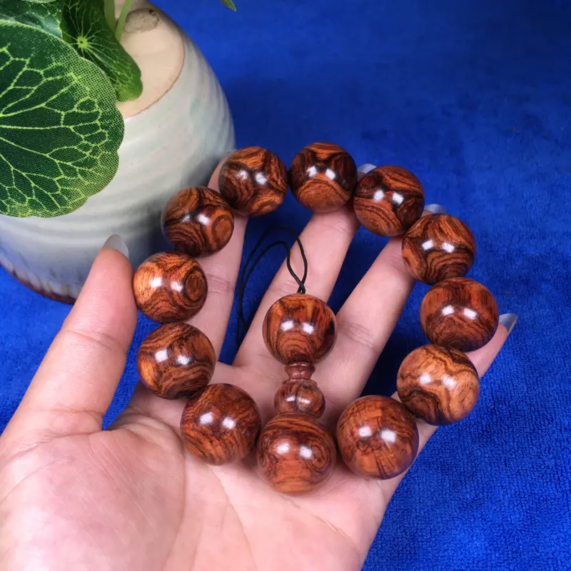 【海南黄花梨糠梨 20mm/12颗对眼X纹 颗颗圆润饱满 颜色均匀 线条流畅自然 重45.1g】图4