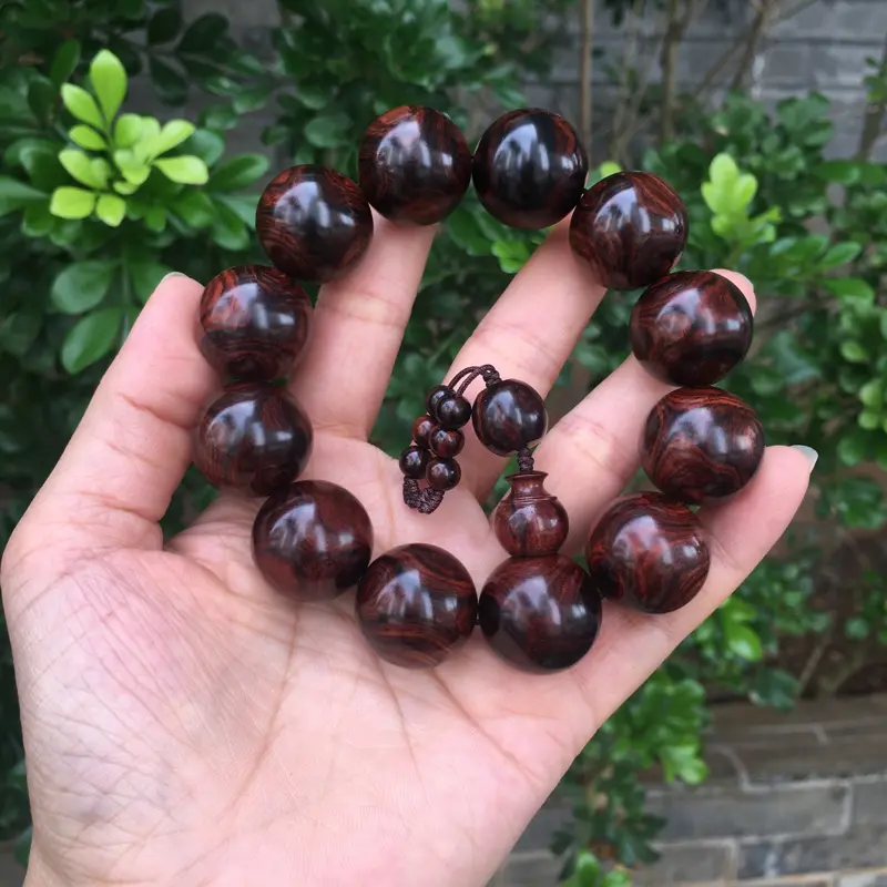 【海南黄花梨西部霸王岭紫油梨2.0规格的手串,玻璃质感,荧光感十足,鬼眼对眼京剧脸谱,克重52.2g】图3