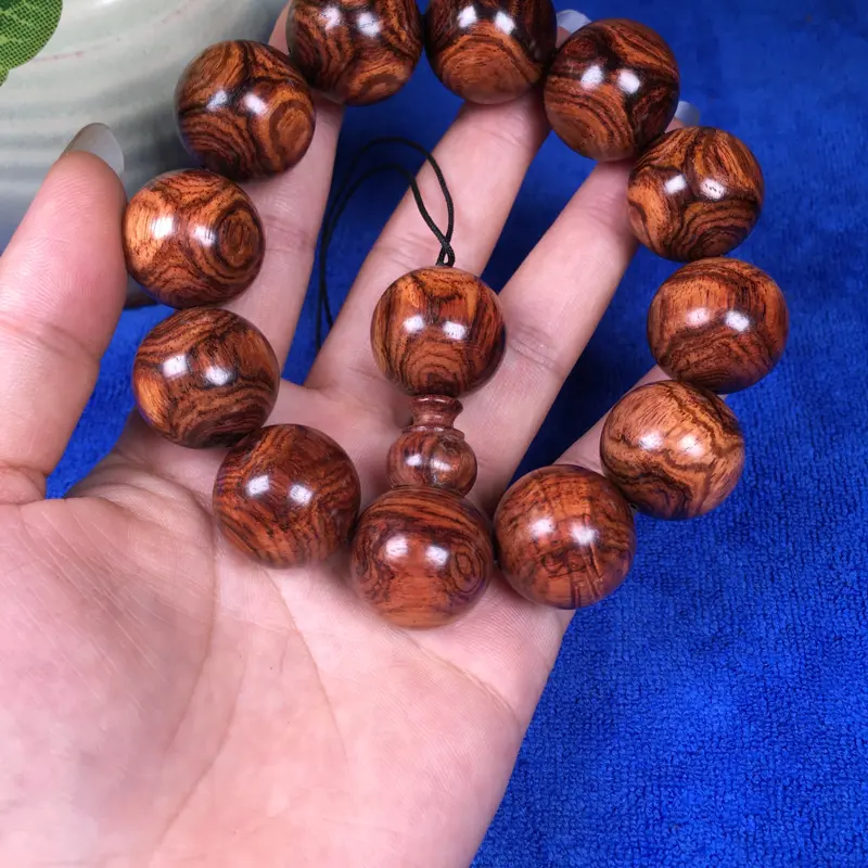 【海南黄花梨糠梨 20mm/12颗对眼X纹 颗颗圆润饱满 颜色均匀 线条流畅自然 重45.1g】图2